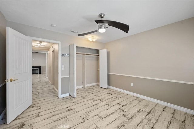 618 E Sunset Dr N, Redlands, CA 92373 - unfurnished bedroom featuring wood finished floors, a closet, and a ceiling fan