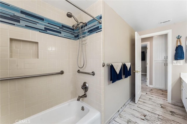 618 E Sunset Dr N, Redlands, CA 92373 - full bath with washtub / shower combination, vanity, and wood finished floors