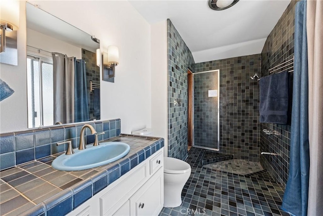 618 E Sunset Dr N, Redlands, CA 92373 - full bathroom featuring tiled shower, vanity, and tile patterned floors