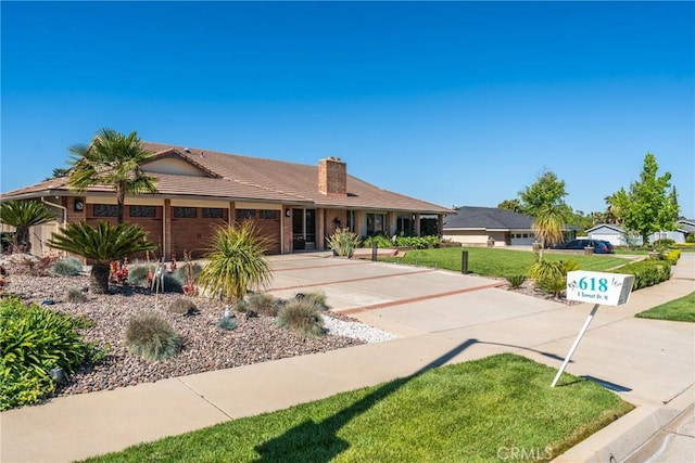618 E Sunset Dr N, Redlands, CA 92373 - ranch-style home featuring driveway, a garage, a front yard, a chimney, and a tile roof