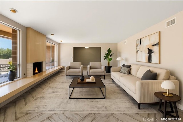 618 E Sunset Dr N, Redlands, CA 92373 - living room with a lit fireplace and baseboards