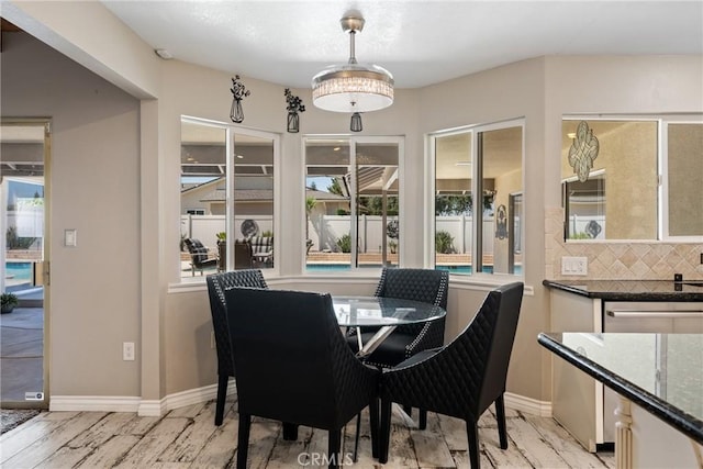 618 E Sunset Dr N, Redlands, CA 92373 - dining room featuring baseboards and light wood-style floors