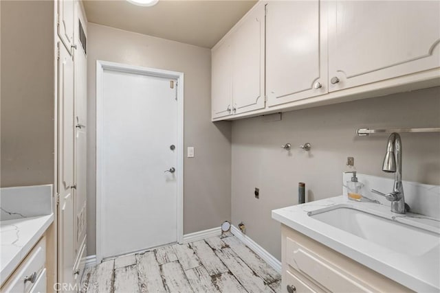 618 E Sunset Dr N, Redlands, CA 92373 - washroom with cabinet space, hookup for an electric dryer, light wood finished floors, and washer hookup