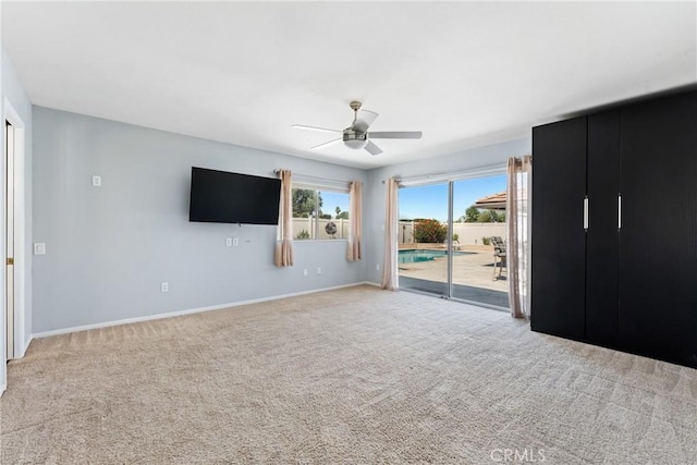 618 E Sunset Dr N, Redlands, CA 92373 - unfurnished bedroom featuring access to exterior, carpet, and ceiling fan