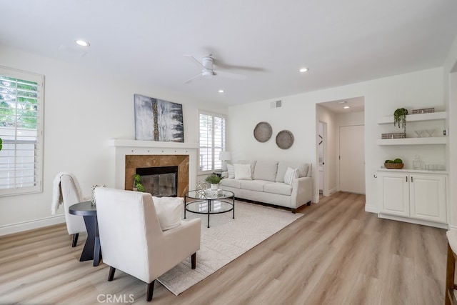 2115 Via Viejo, San Clemente, CA 92673 - living room featuring healthy amount of natural light, light wood-style floors, ceiling fan, a fireplace, and recessed lighting