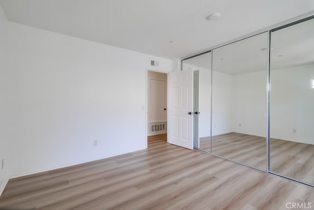 2115 Via Viejo, San Clemente, CA 92673 - unfurnished bedroom featuring light wood-style floors and a closet