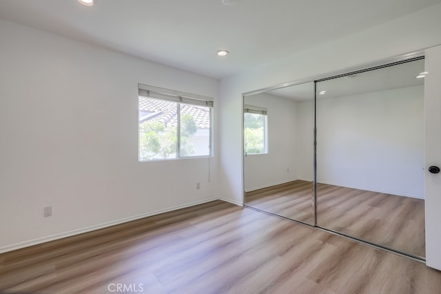 2115 Via Viejo, San Clemente, CA 92673 - unfurnished bedroom with recessed lighting, wood finished floors, a closet, and baseboards