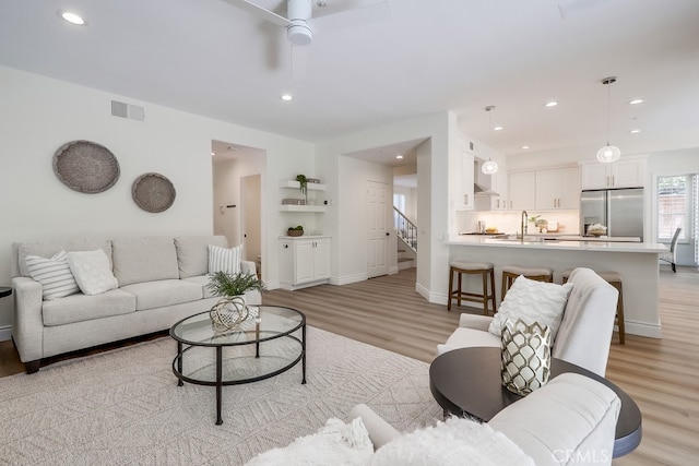 2115 Via Viejo, San Clemente, CA 92673 - living area with light wood-type flooring, a ceiling fan, stairway, recessed lighting, and baseboards