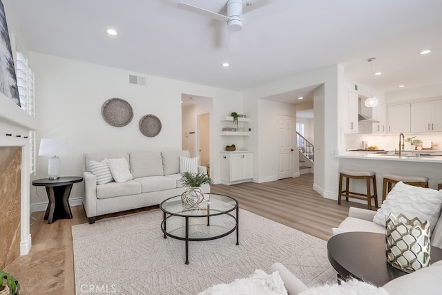 2115 Via Viejo, San Clemente, CA 92673 - living room featuring light wood-style flooring, ceiling fan, stairway, recessed lighting, and baseboards