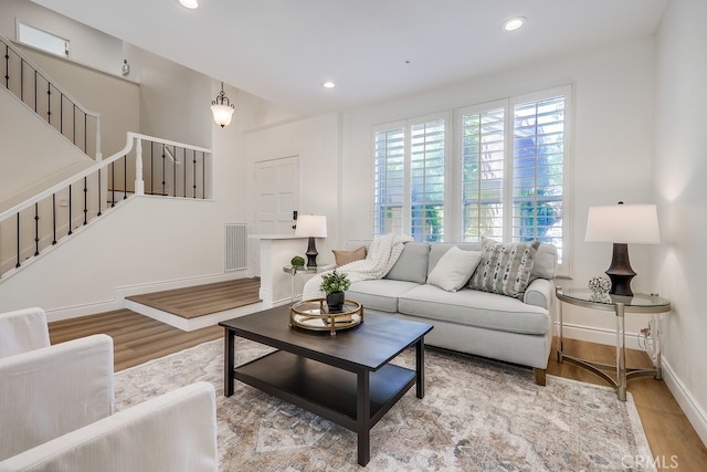 2115 Via Viejo, San Clemente, CA 92673 - living room featuring wood finished floors, stairs, baseboards, and recessed lighting