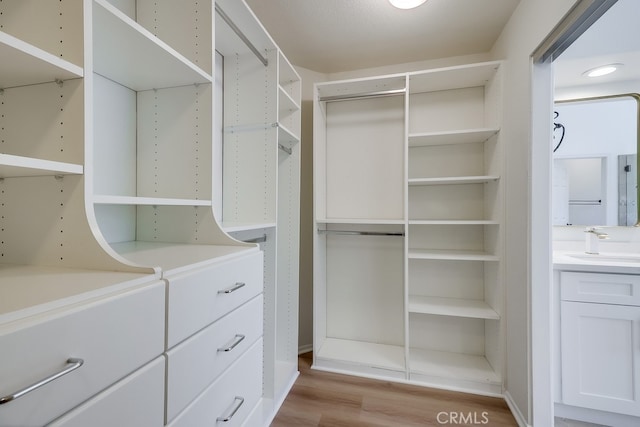 2115 Via Viejo, San Clemente, CA 92673 - walk in closet with a sink and light wood-style floors