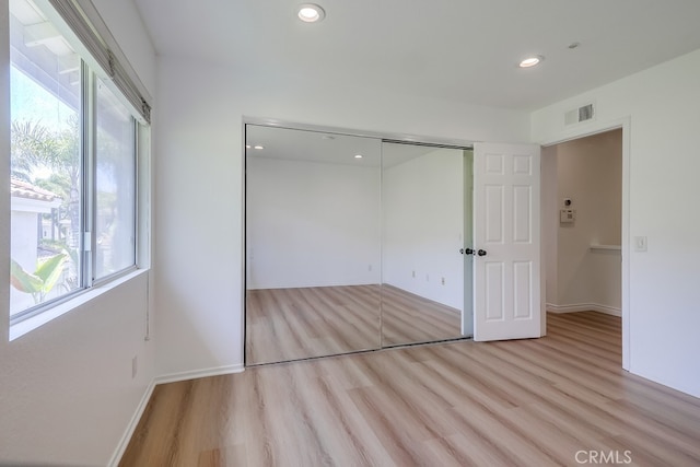 2115 Via Viejo, San Clemente, CA 92673 - unfurnished bedroom with wood finished floors, recessed lighting, a closet, and baseboards