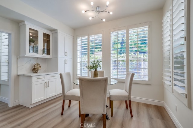 2115 Via Viejo, San Clemente, CA 92673 - dining room with light wood-style flooring, a chandelier, healthy amount of natural light, and baseboards