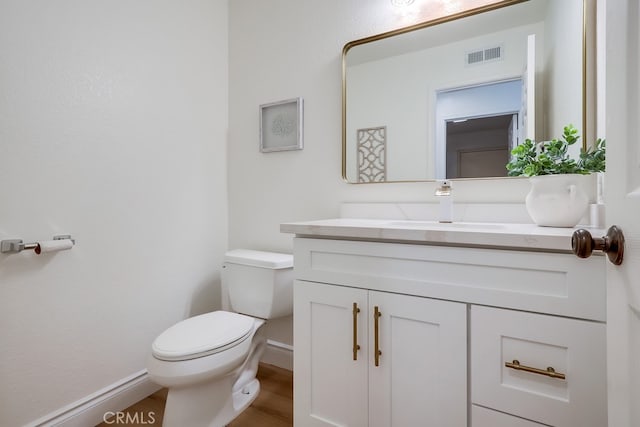 2115 Via Viejo, San Clemente, CA 92673 - bathroom featuring toilet, vanity, wood finished floors, and baseboards