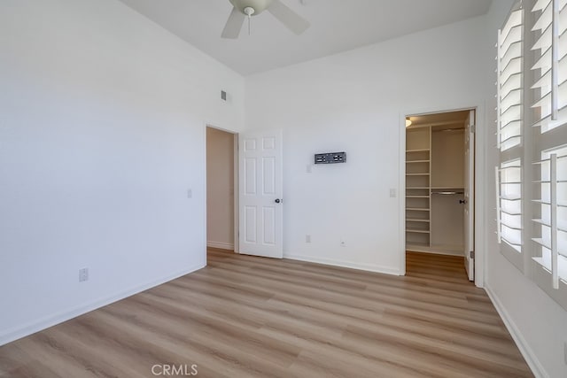 2115 Via Viejo, San Clemente, CA 92673 - spare room featuring ceiling fan, light wood finished floors, a towering ceiling, and baseboards
