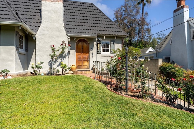 1194 Avoca Ave, Pasadena, CA 91105 - doorway to property featuring a tile roof, stucco siding, and a chimney