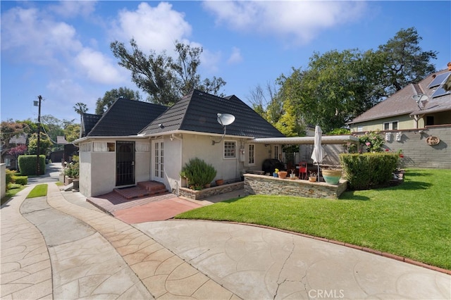 1194 Avoca Ave, Pasadena, CA 91105 - back of house with a patio, stucco siding, and a lawn