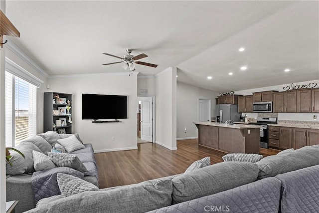 2289 Kyla Ct, San Bernardino, CA 92410 - living room featuring baseboards, dark wood-style flooring, crown molding, a ceiling fan, and recessed lighting