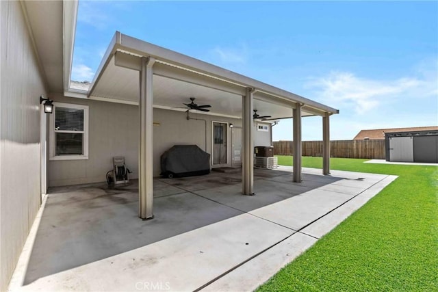 2289 Kyla Ct, San Bernardino, CA 92410 - view of patio / terrace with a ceiling fan, an outdoor structure, and a storage unit