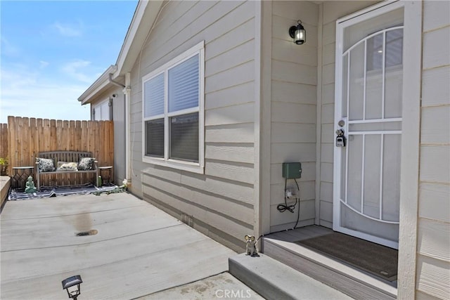2289 Kyla Ct, San Bernardino, CA 92410 - view of exterior entry with fence and a patio