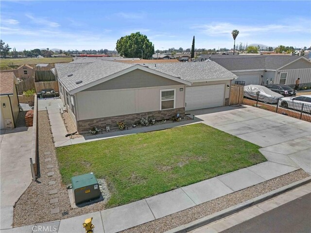 2289 Kyla Ct, San Bernardino, CA 92410 - single story home featuring driveway, a garage, a residential view, stone siding, and roof with shingles