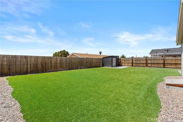 2289 Kyla Ct, San Bernardino, CA 92410 - view of yard with a storage shed and an outbuilding