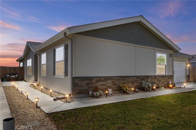 2289 Kyla Ct, San Bernardino, CA 92410 - view of home's exterior with an attached garage and stone siding