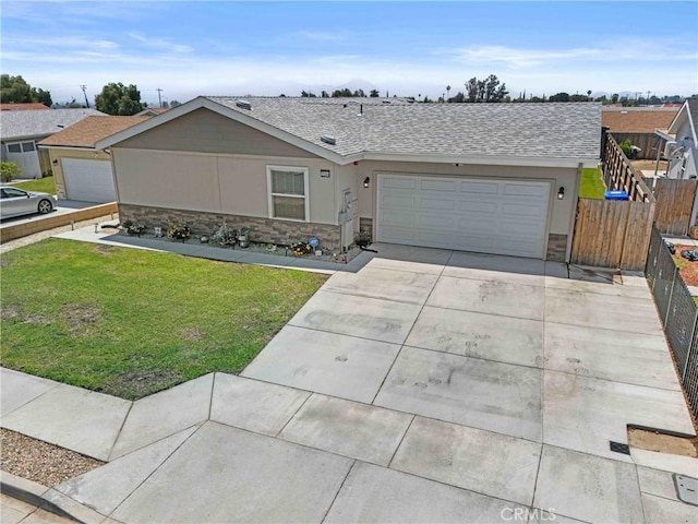 2289 Kyla Ct, San Bernardino, CA 92410 - single story home featuring stone siding, a garage, driveway, and roof with shingles