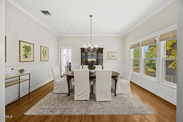 260 W Carter Ave, Sierra Madre, CA 91024 - dining area featuring a chandelier, recessed lighting, a decorative wall, crown molding, and wood finished floors