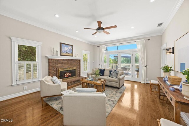 260 W Carter Ave, Sierra Madre, CA 91024 - living room with ceiling fan, ornamental molding, baseboards, wood finished floors, and a brick fireplace
