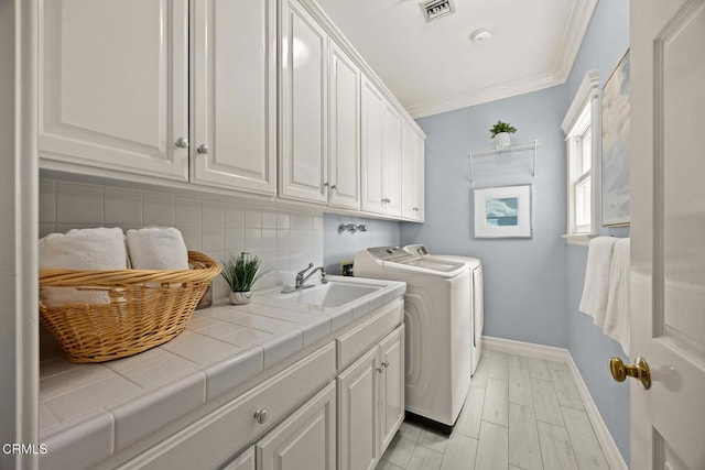 260 W Carter Ave, Sierra Madre, CA 91024 - washroom featuring cabinet space, washer and dryer, ornamental molding, and baseboards