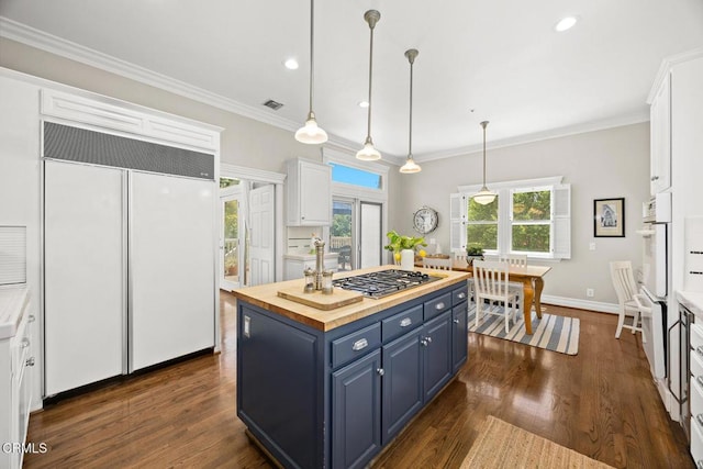 260 W Carter Ave, Sierra Madre, CA 91024 - kitchen featuring blue cabinetry, paneled refrigerator, stainless steel gas stovetop, butcher block countertops, and white cabinetry