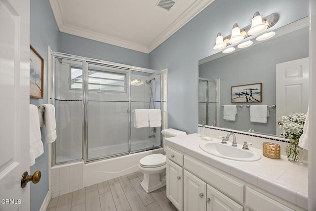 260 W Carter Ave, Sierra Madre, CA 91024 - full bath with ornamental molding, vanity, combined bath / shower with glass door, toilet, and wood tiled floors