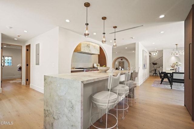 620 S Allen Ave, San Marino, CA 91108 - bar area with recessed lighting, light wood-style floors, baseboards, stairs, and hanging light fixtures
