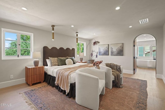 620 S Allen Ave, San Marino, CA 91108 - bedroom with recessed lighting, multiple windows, light wood-style floors, baseboards, and arched walkways