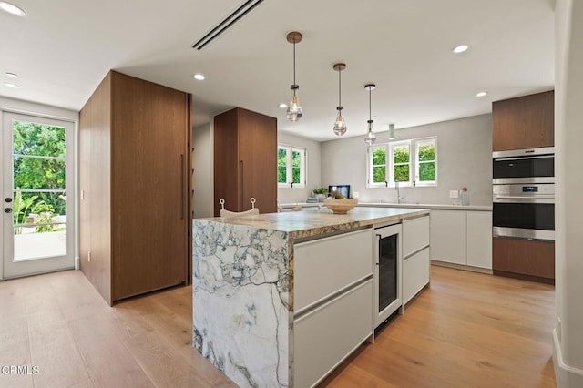 620 S Allen Ave, San Marino, CA 91108 - kitchen with beverage cooler, white cabinets, light wood-style flooring, modern cabinets, and recessed lighting
