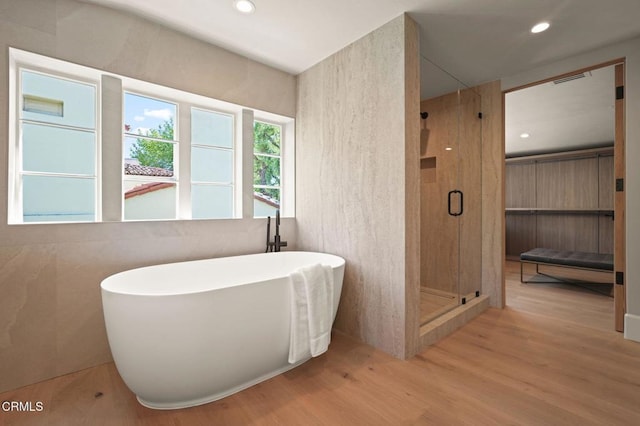 620 S Allen Ave, San Marino, CA 91108 - bathroom featuring wood finished floors, a stall shower, a freestanding bath, and recessed lighting