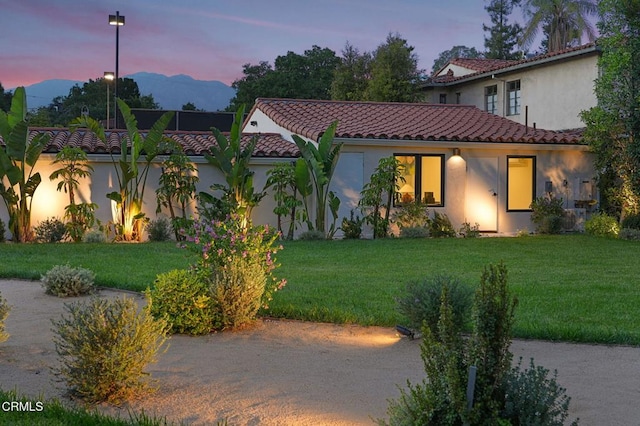 620 S Allen Ave, San Marino, CA 91108 - view of front of house with a tile roof, a yard, stucco siding, and a mountain view
