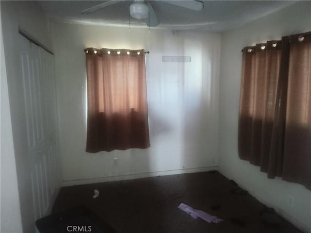 unfurnished room featuring ceiling fan