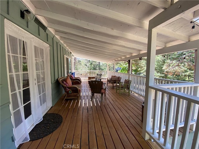 wooden deck with an outdoor hangout area