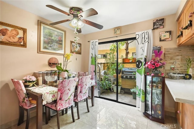 dining space with ceiling fan