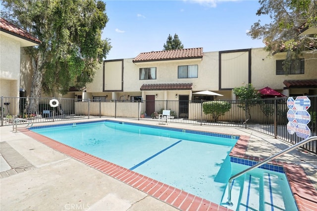 community pool featuring fence