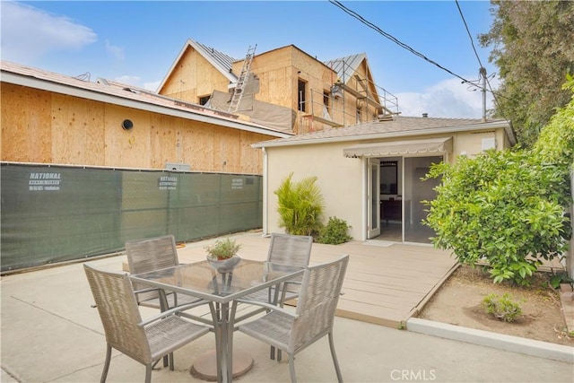 5314 E 4th St, Long Beach, CA 90814 - view of patio / terrace featuring fence, a wooden deck, and outdoor dining area