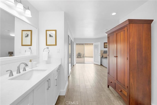 5314 E 4th St, Long Beach, CA 90814 - bathroom featuring vanity, wood finished floors, and recessed lighting