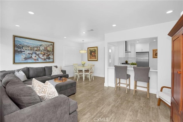 5314 E 4th St, Long Beach, CA 90814 - living room with recessed lighting, light wood-style floors, and baseboards