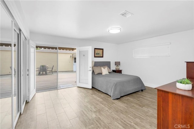 5314 E 4th St, Long Beach, CA 90814 - bedroom featuring wood finished floors, access to outside, and baseboards