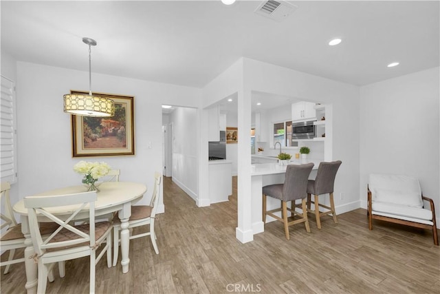 5314 E 4th St, Long Beach, CA 90814 - dining space with light wood-type flooring, baseboards, and recessed lighting