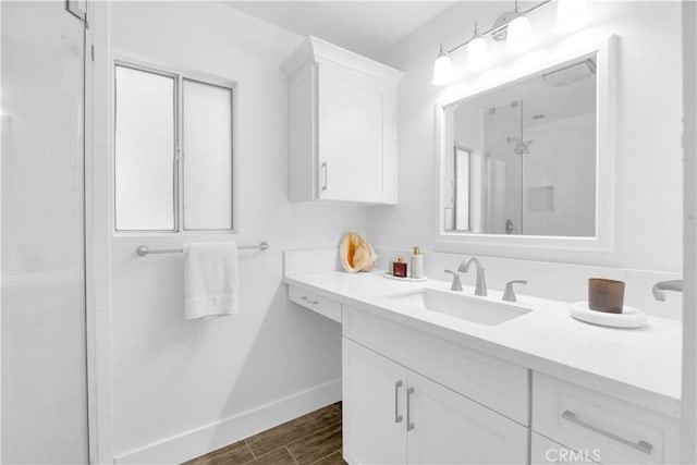 5314 E 4th St, Long Beach, CA 90814 - bathroom featuring a shower stall, baseboards, vanity, and wood finished floors