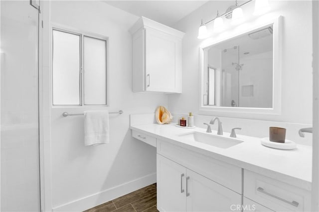 5314 E 4th St, Long Beach, CA 90814 - full bathroom featuring vanity, a shower stall, and wood finished floors