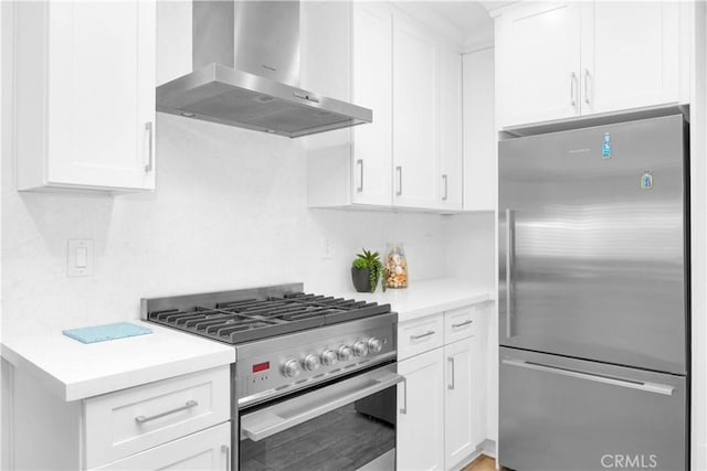 5314 E 4th St, Long Beach, CA 90814 - kitchen with stainless steel appliances, wall chimney exhaust hood, light countertops, and white cabinets